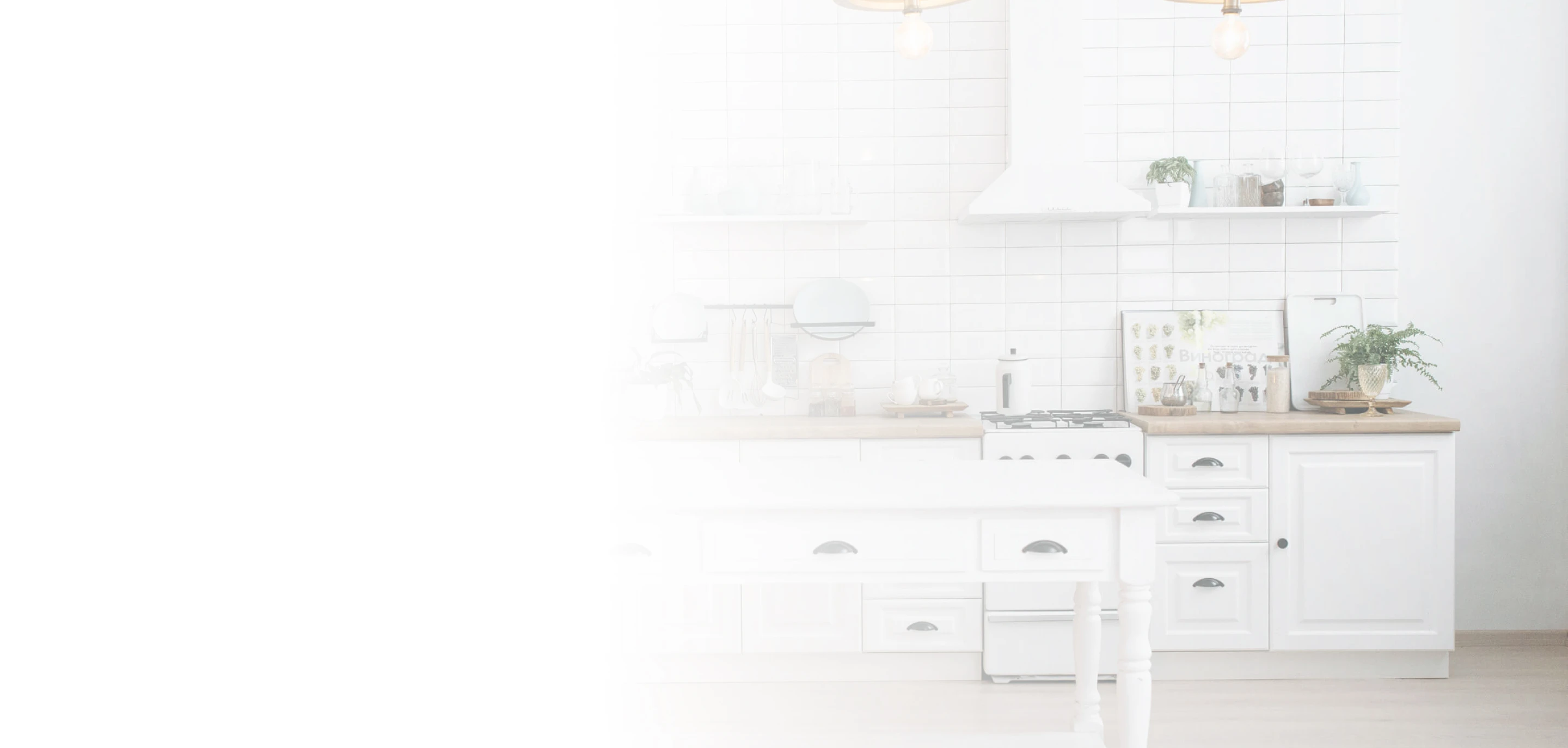 A white kitchen with a sink and a stove
