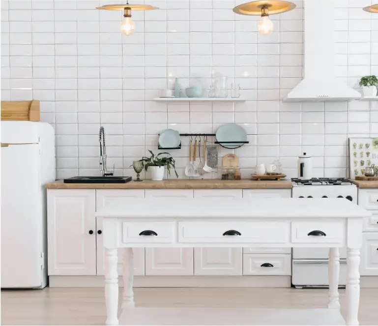 A kitchen with white cabinets and white appliances